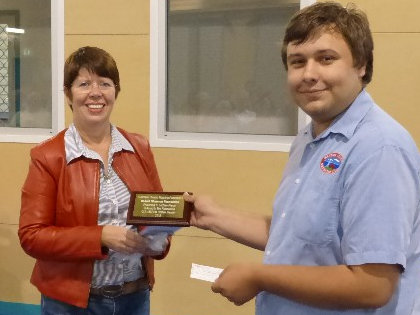 Left to right: Christine Stevens presents grant to Lachlan Pierce.