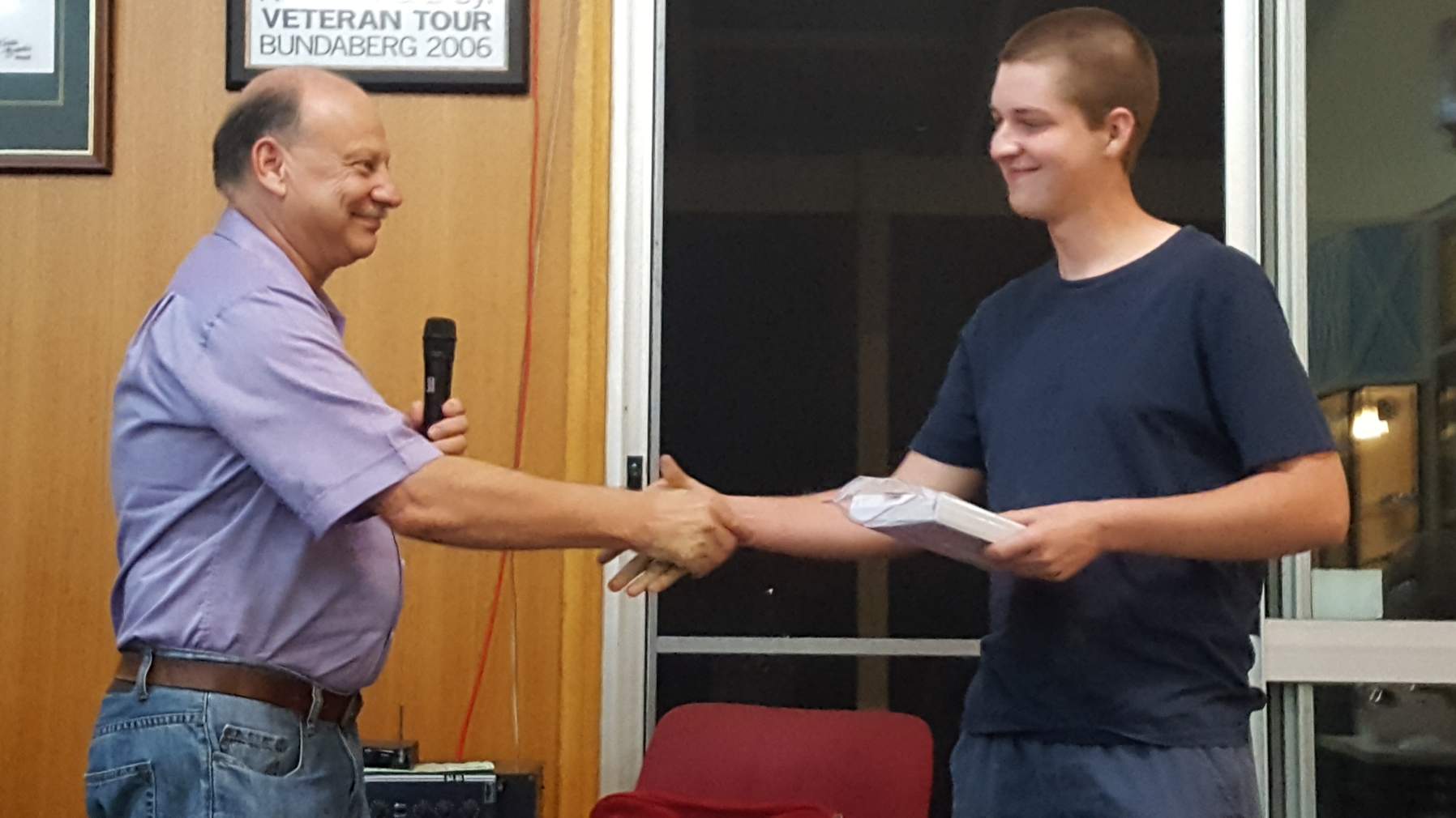 Left to right: Russell Manning presents grant to James Brennan.